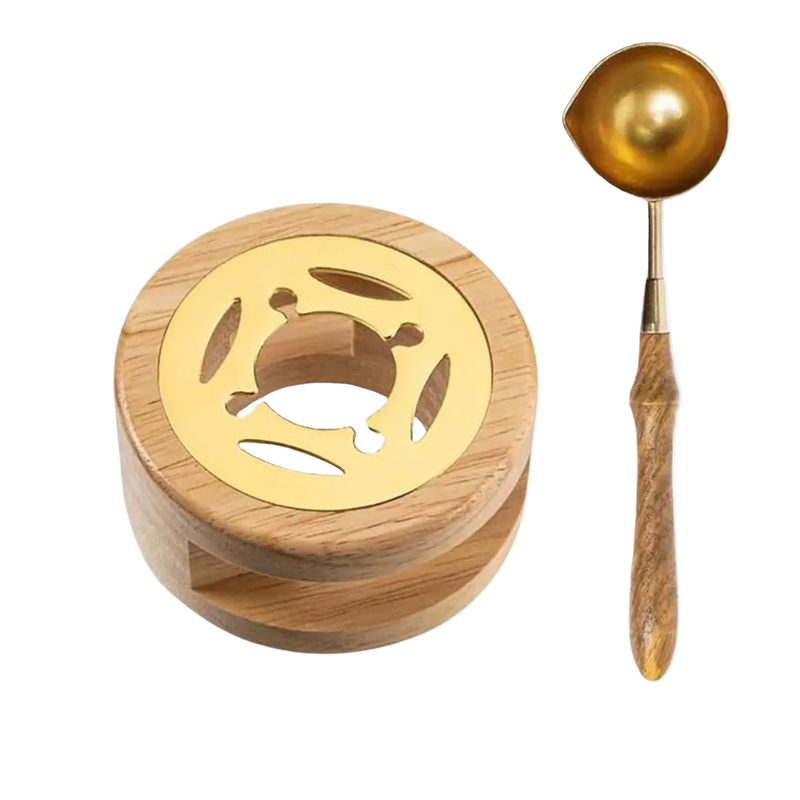 Wooden container with gold lid and matching spoon on a white background
